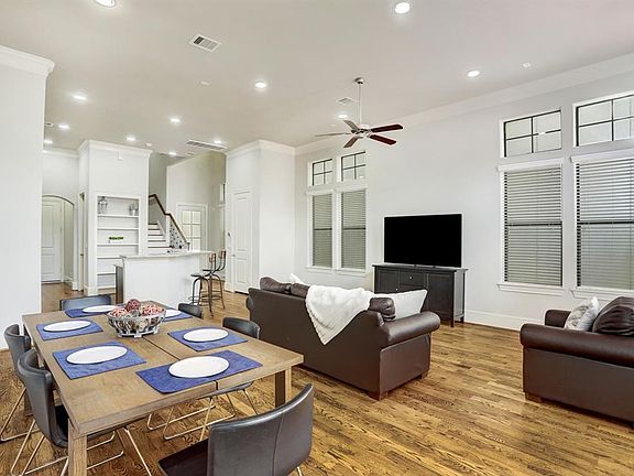 This space is so grand that it can host an array of furniture placement. Direct access to back yard!