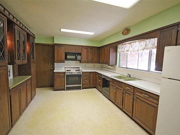 Huge kitchen with pantry and tons of cabinet space.