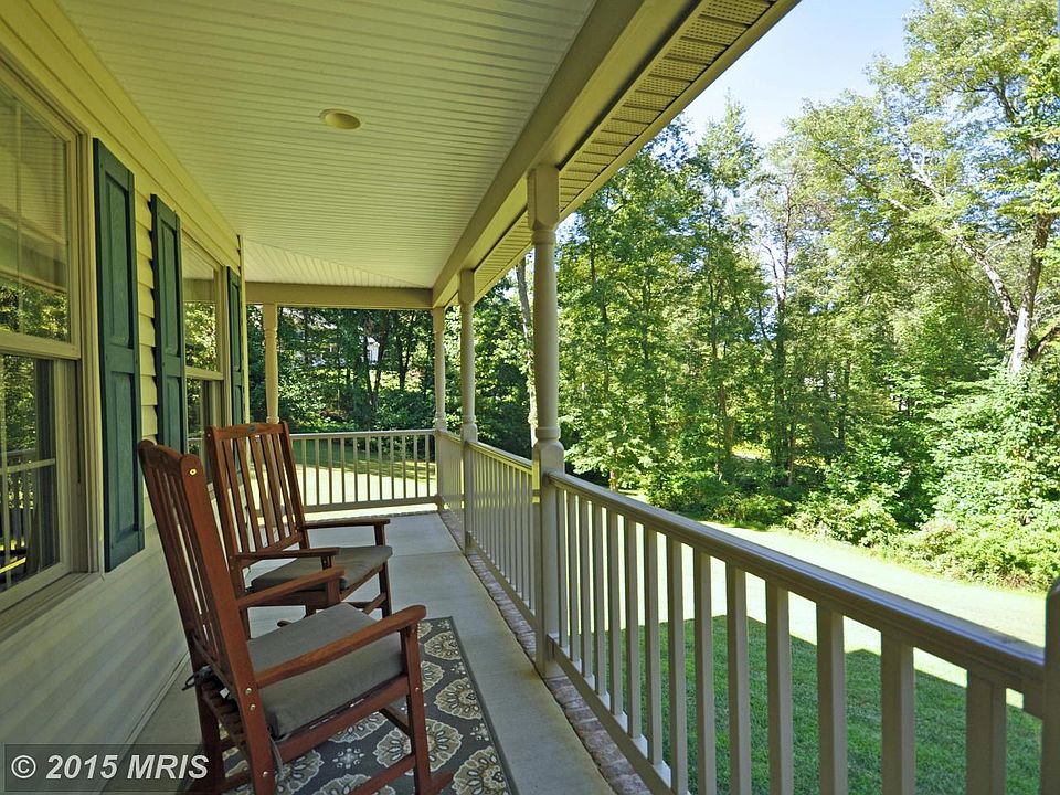 Wraparound Porch with Serene Wooded View