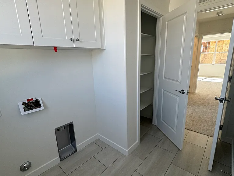 Laundry room with storage (renter to provide own washer/dryer)