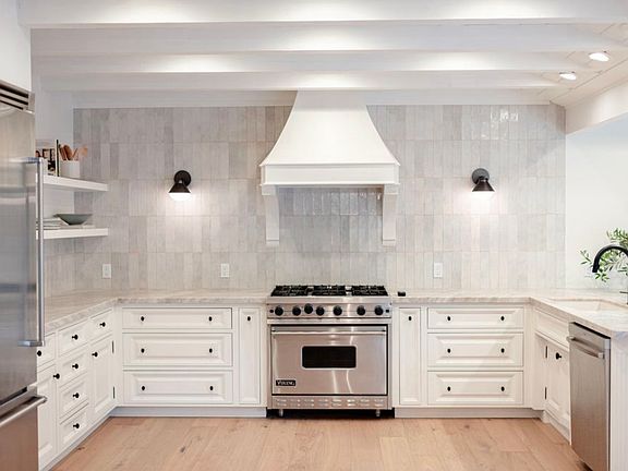 Designer kitchen with premium finishes and appliances.