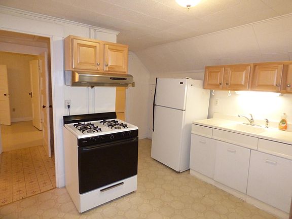 Kitchen with refrigerator and gas stove