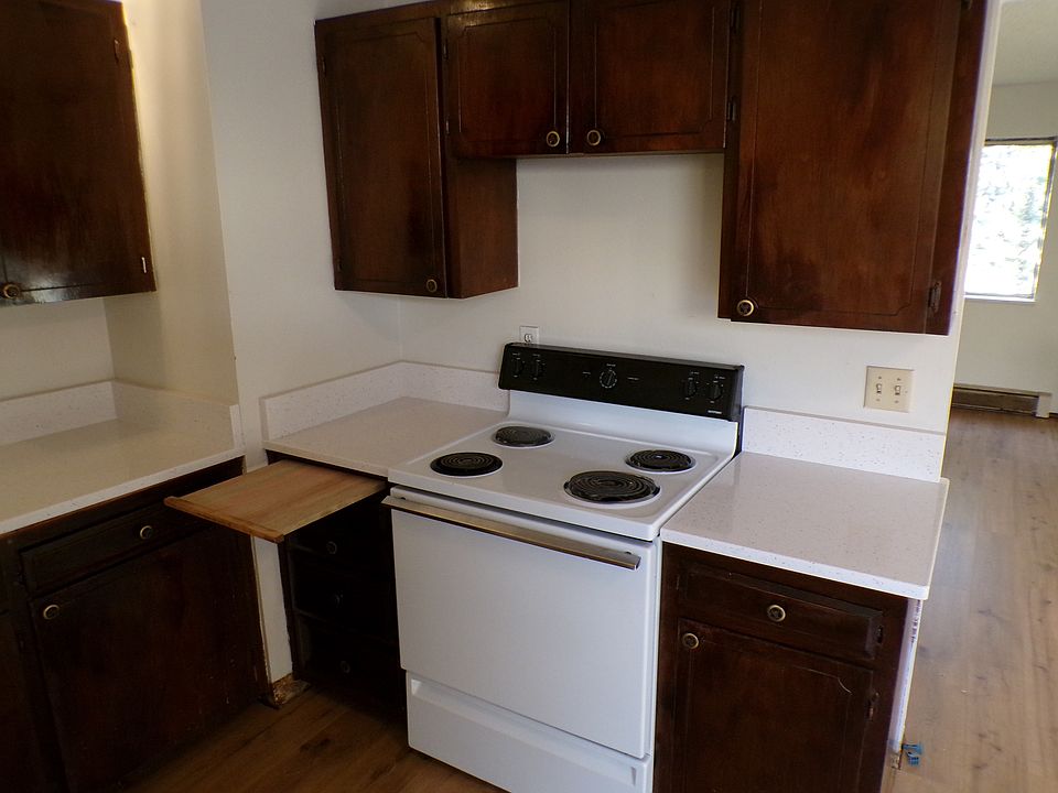 Kitchen with new countertops and new cutting board. There are soft close drawers.