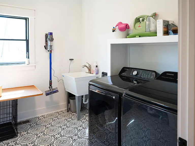 Laundry Room with Dyson Vacuum
