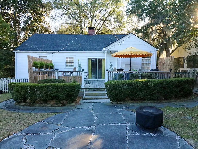 Spacious back yard, mostly fenced in, with massive patio that connects to the kitchen and bonus room