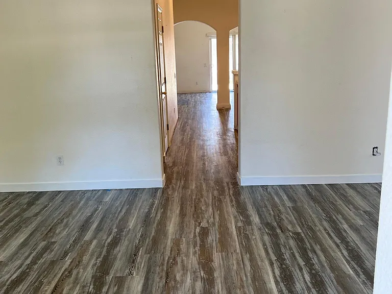 Living room leads to the Kitchen