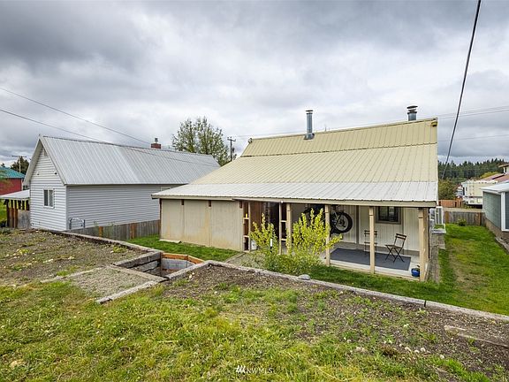 Back of house from alley with lots of room for parking