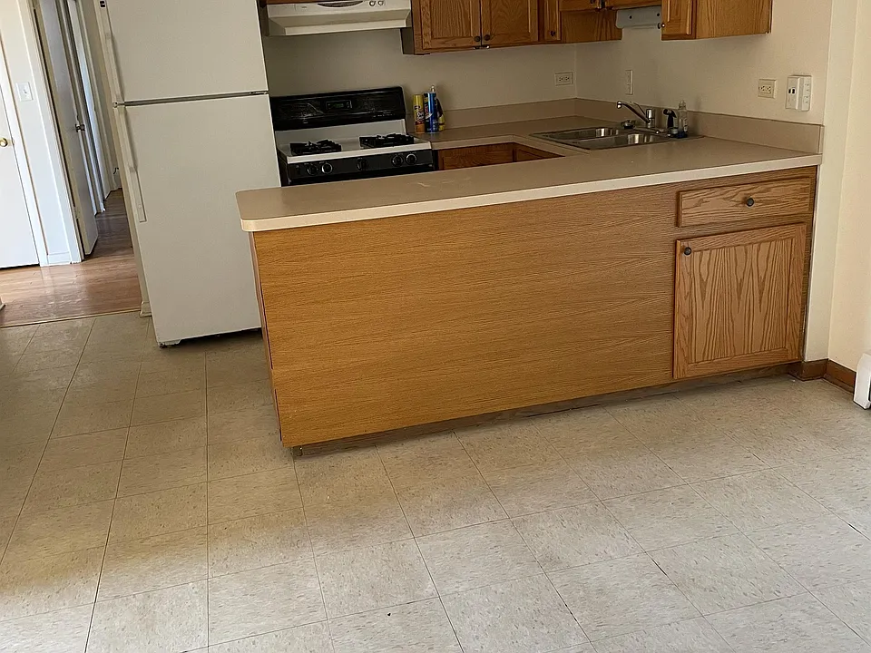 View of kitchen and dining area from the door