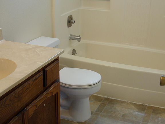 Full bath prior to remodel with new vanity, and new flooring