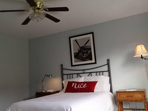 Bedroom 1 with a king size bed and studded linen headboard (updated compared to photo)
