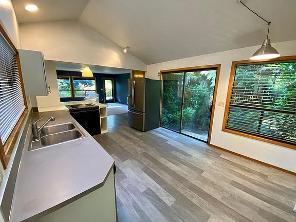 Corner kitchen nook for breakfast table. Kitchen looks into livingroom.