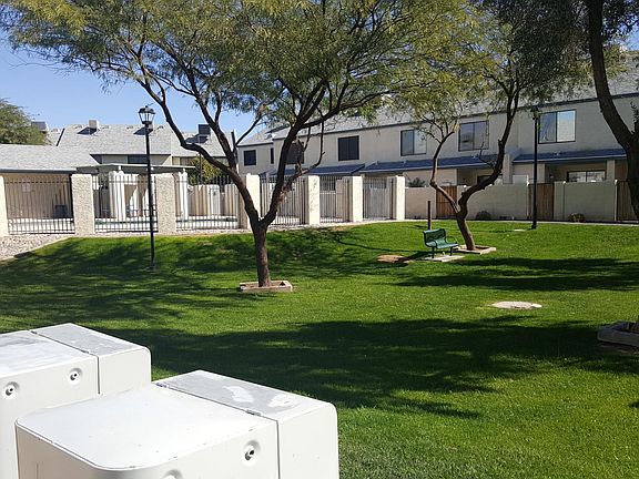 One of many green belt areas and pool.