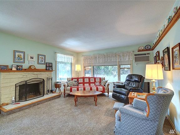 A comfortable living room with loads of natural light. 