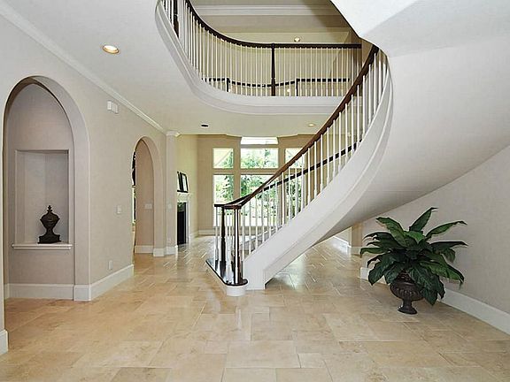 Two Story Entry with Circular Floating Staircase