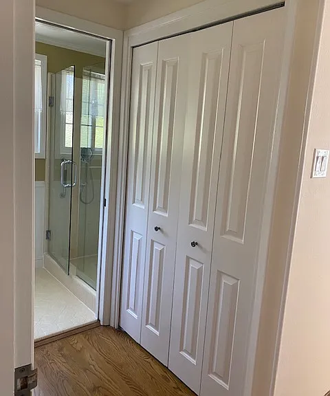 one of 3 master bed closets