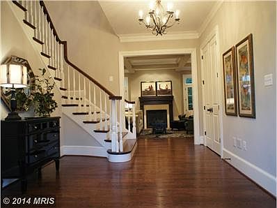 Elegant foyer with curved stairway
