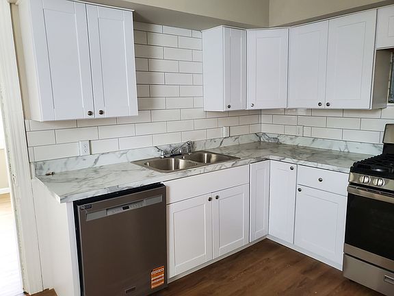 Newly remodeled kitchen including new stainless steel appliances...gas range, dishwasher, refrigerator.