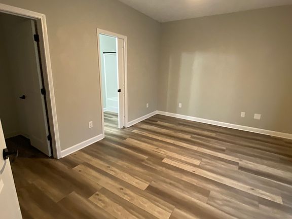 1st bedroom - left door opening is walk in closet & right open door is jack and Jill bathroom