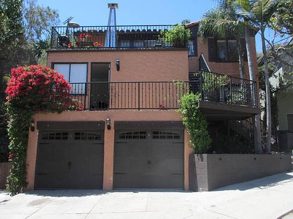Garage parking with one spot in front of the garage.