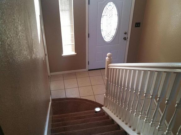 view down the stairs looking at front door