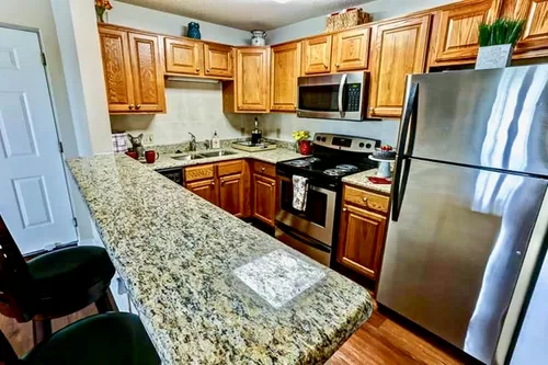 State-of-the-Art Kitchen with Stainless Steel Appliances - Windsong Place Apartments