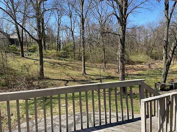 Deck overlooking wooded lot