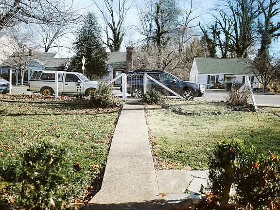 View of the street. Yard is about 3/4 fenced-in. Additional on-street parking for guests