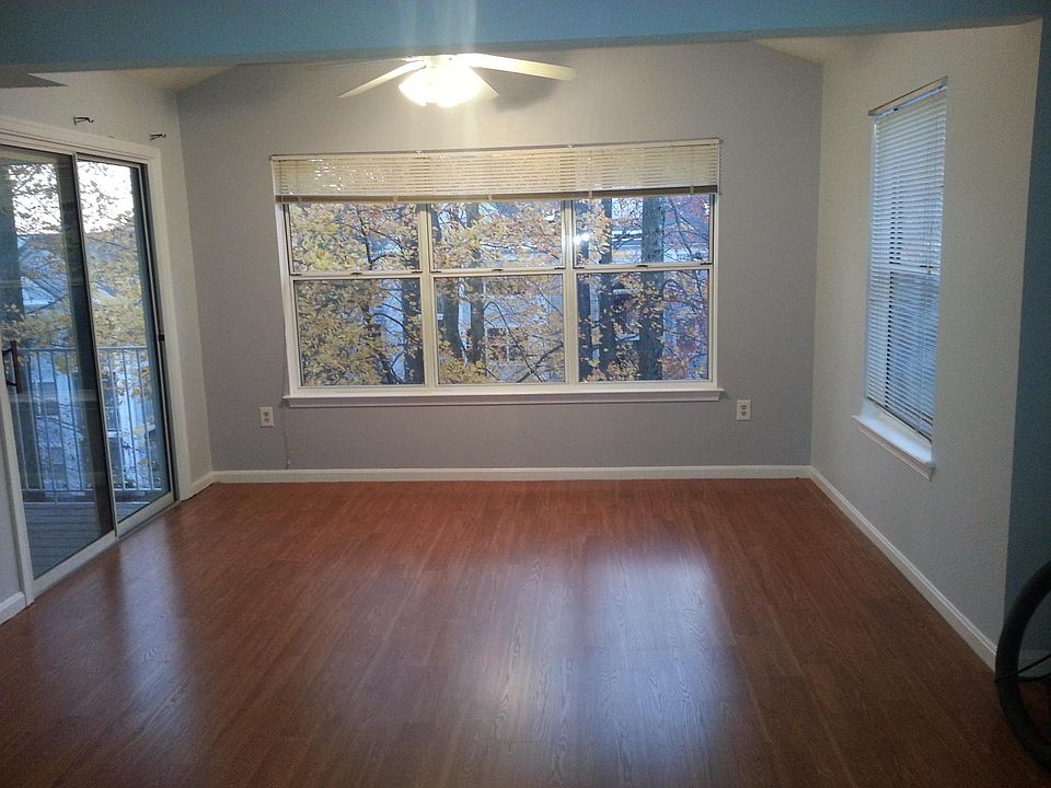Living Area overlooks wood and balcony access