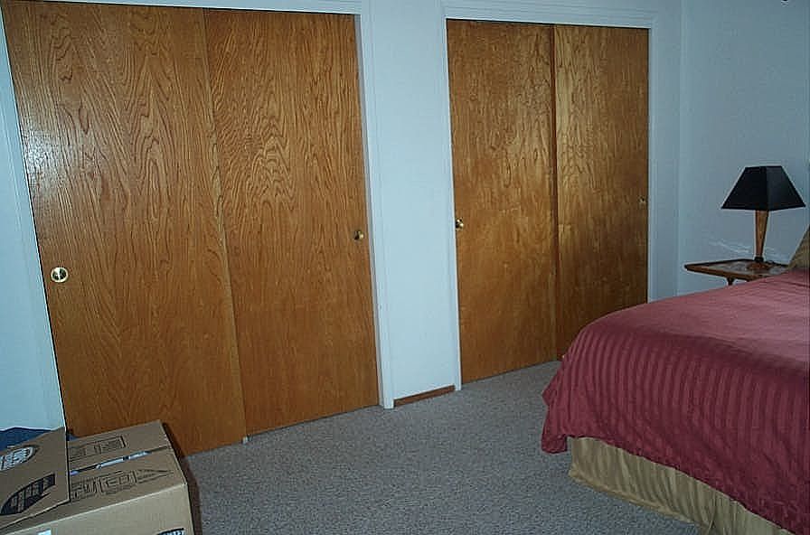 bedroom showing closet doors