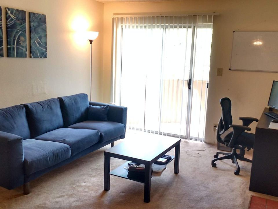 family room w/ fire place and Balcony