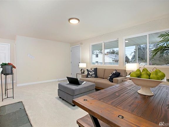 Big windows in living room invites natural light in.