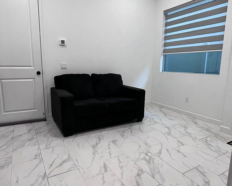 Hallway with Love seat and carpet