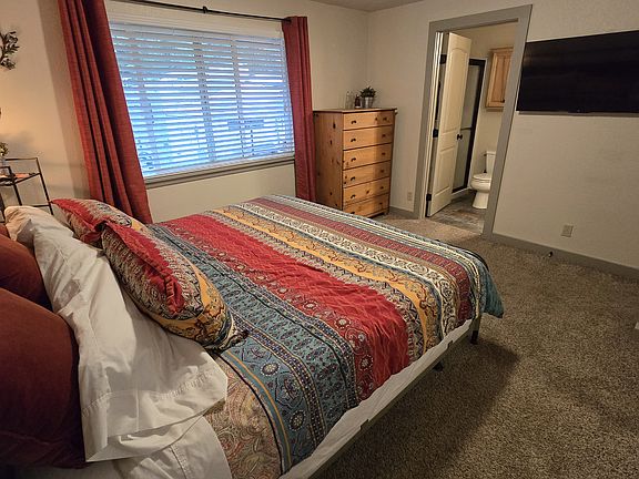 Primary suite w/ King bed. Bedrooms do not share wall with neighbors.