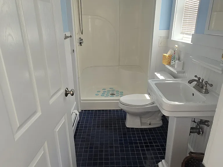 Bath with sit in shower.