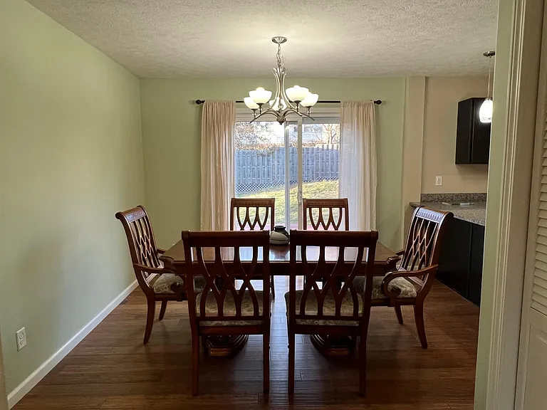Dinning area with sliding glass door to back yard.
