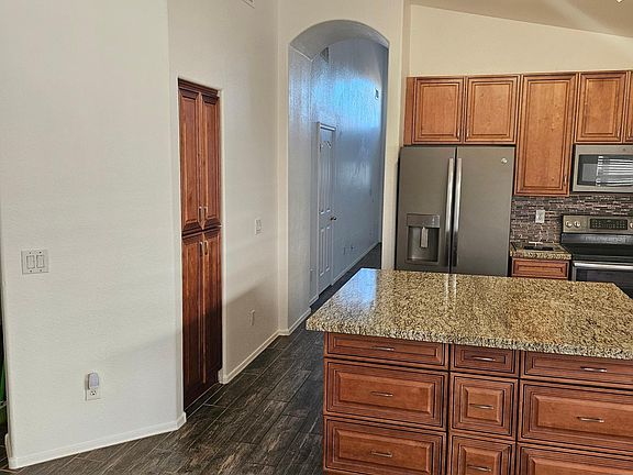 Kitchen with updated cabinets, island and appliances.