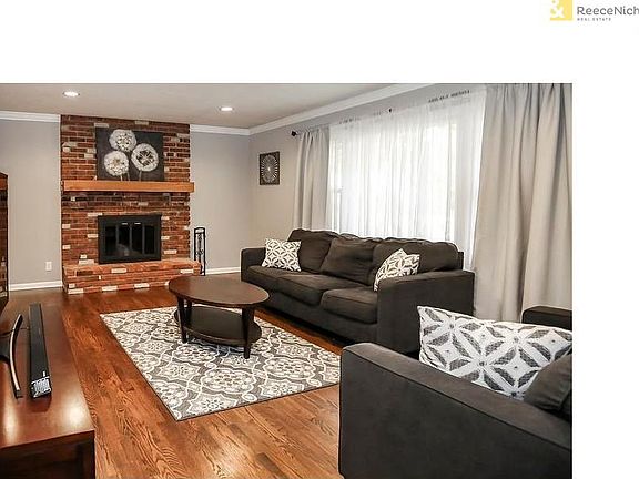 The brick fireplace provides a warm cozy feel to the room.