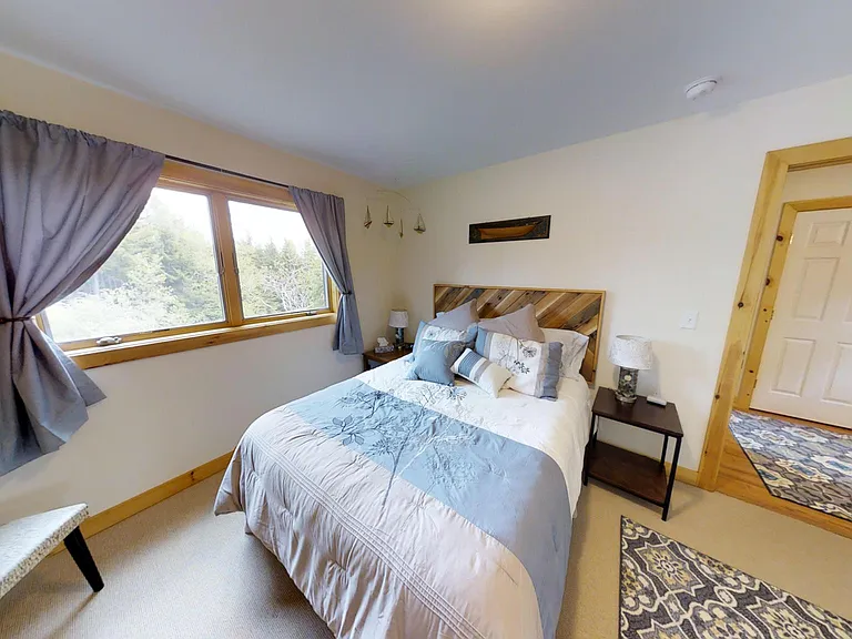 Lower level bedroom 2 with queen size bed