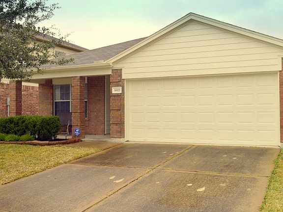 Covered front porch & 2 car attached garage.