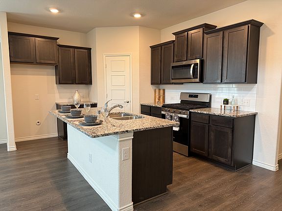Kitchen with a full size pantry closet