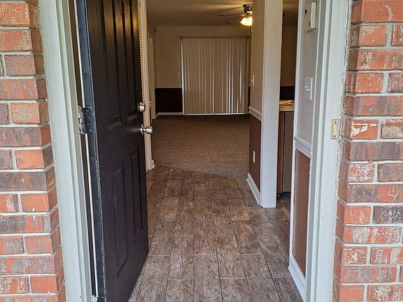 Front Door and Foyer with new tile floor. Enter from a large covered front porch.