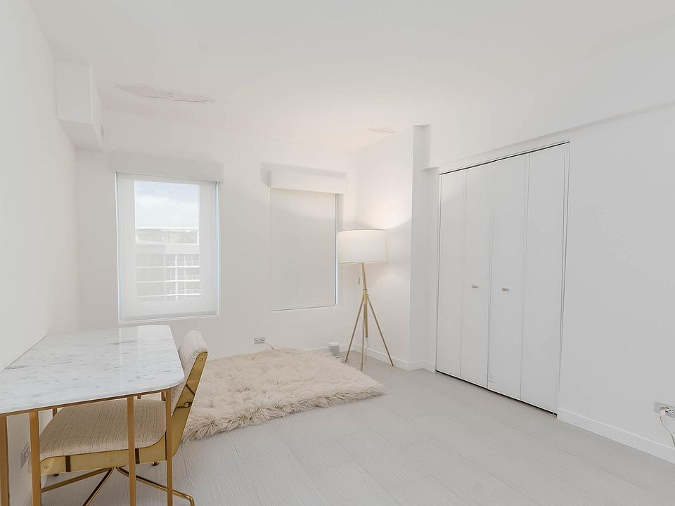 Extra room in the master bedroom being utilized as a home office.