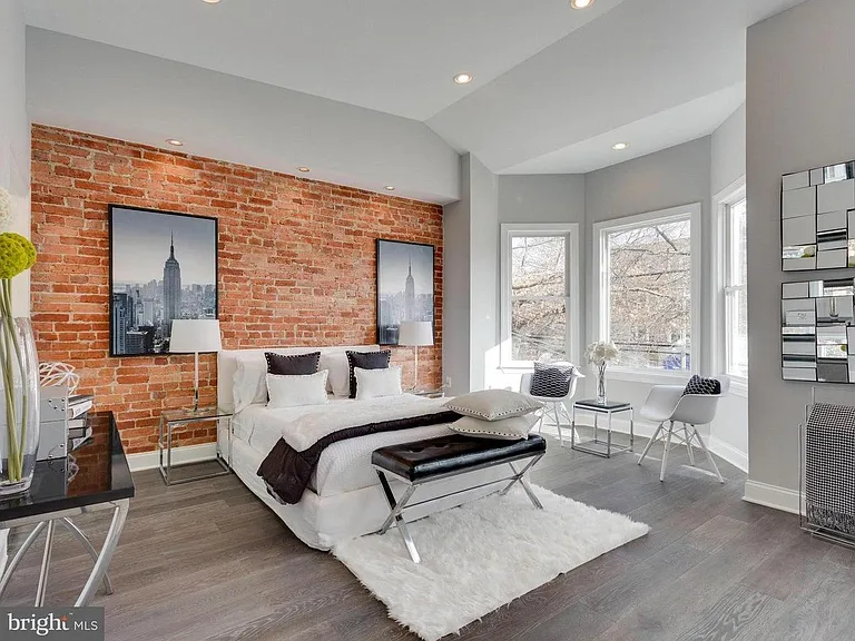 Master Bedroom: Dramatic Lighting, Exposed Brick, 10'+ Ceilings, Bay Window