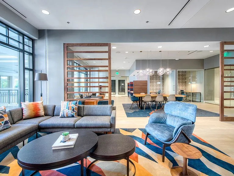 Modern resident lounge with a variety of seating options.