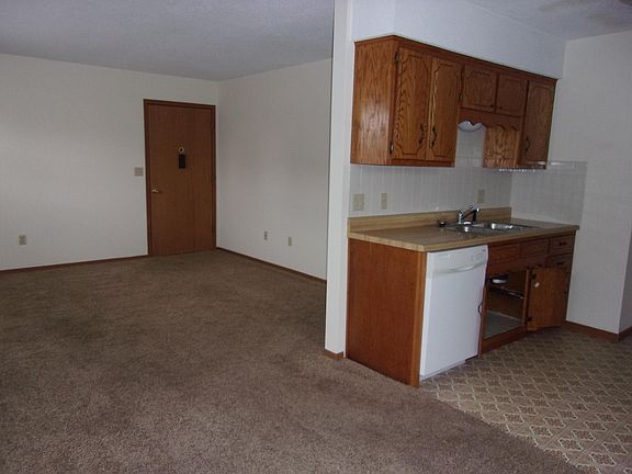 kitchen, dining area, front door, and living room