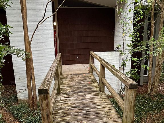 front entrance beyond hedge