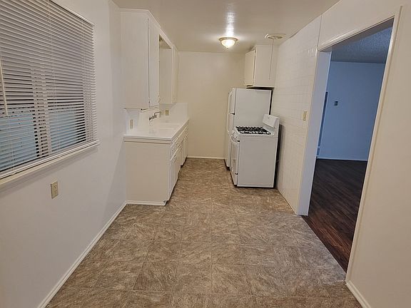 Looking into kitchen space from laundry room.
