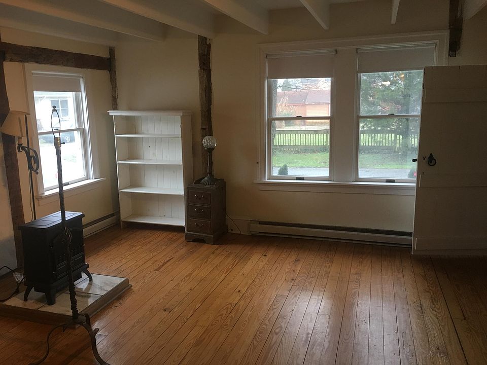 Living room with electric heat and stove.