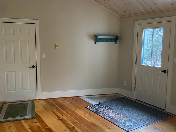 Entryway between house and garage. Can be used as dining room