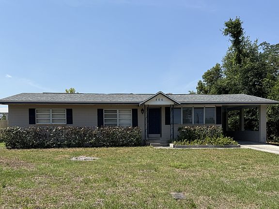 Carport on right, with Laundry Room in rear-- ready for your washer/dryer.